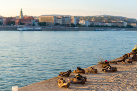 Bronze shoes lined along the Danube River bank as Holocaust Memorial in Budapest, Hungary.の写真素材