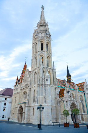 Detailed view of the Gothic tower of Matthias Church with colorful tiled roof in Budapest, Hungary.の写真素材