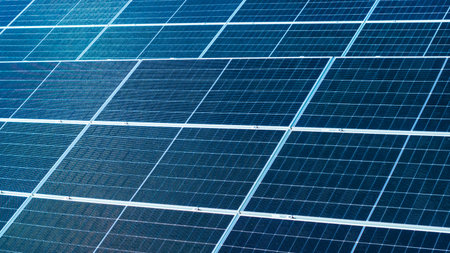 Geometric aerial close-up showing blue solar panel textures and symmetryの写真素材