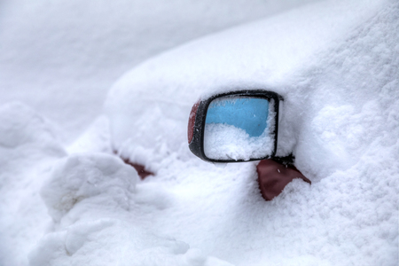 Car rearview mirror under the snow.の写真素材