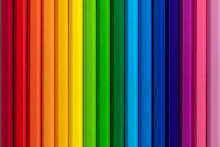Rainbow background made of wooden colour pencils. Flat lay.