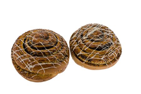 Two roll with a poppy isolated on a white backgroundの写真素材