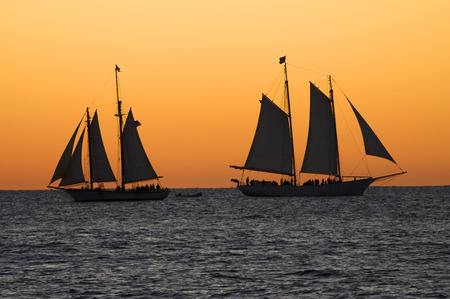 Sailboats at sunset in Key West, Floridaの写真素材