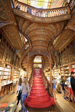 PORTO, PORTUGAL - JULY 07, 2017: High angle view of stairs inside the famous bookshop Lello e Irmao...