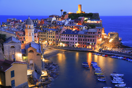 Aerial view of Vernazza vilagge illuminated at dusk on Mediterranean coast, Cinque Terre, Italyの写真素材
