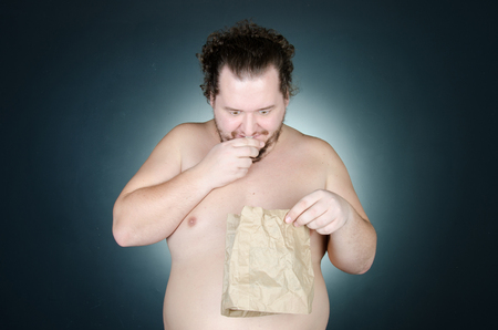 The surprised man looks down.の写真素材