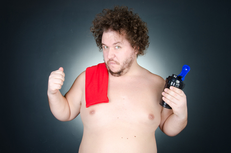The overweight guy. Funny bodybuilding.の写真素材