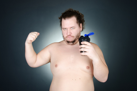 The overweight guy. Funny bodybuilding.の写真素材