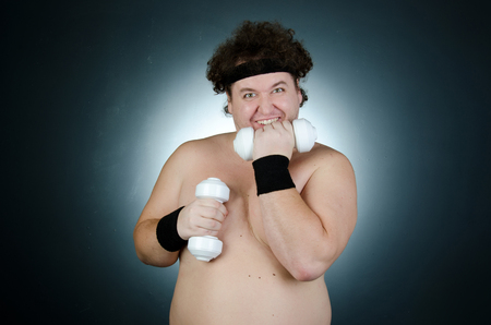 Fitness and healthy lifestyle. Funny fat guy.の写真素材