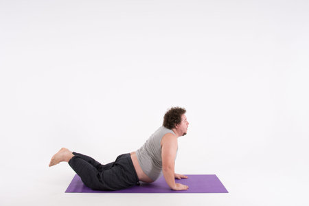 Funny fat man and yoga. Sport, diet and a healthy lifestyle.