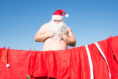 Funny Santa. Daily affairs. Preparing for the holiday.の写真素材