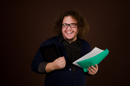 Happy man. Business and work. Good mood. Businessman in glasses with documentsの写真素材