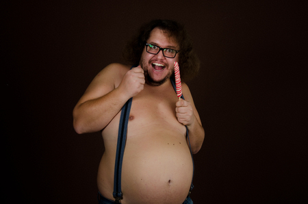 Happy man and candy.の写真素材