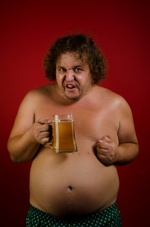 Beer and fat man.の写真素材
