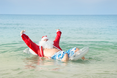 Funny Santa claus in the sea.の写真素材
