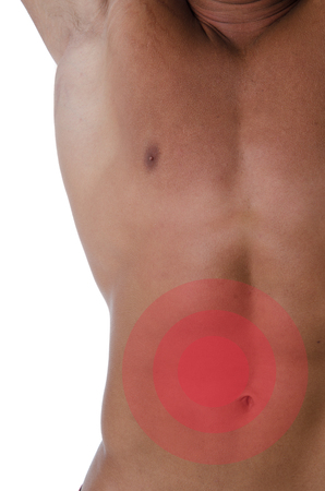 Male torso. Abdominal pain. Young man with sexy body. Fashion and beauty.の写真素材