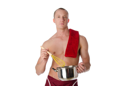 Sexy shirtless cook and pan. Handsome man shirtless is holding a pan. White background.の写真素材