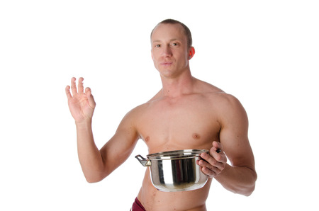 Young sexy cook shirtless. Sexy guy with no shirt. Kitchen and cook.の写真素材