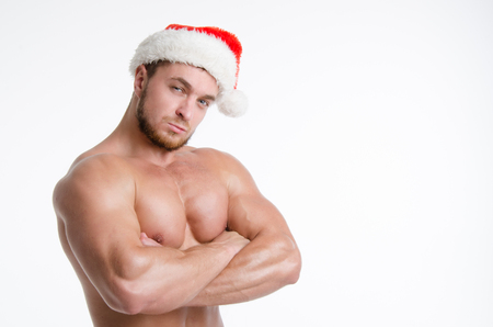 Handsome sexy Santa. Naked athletic Santa with a beautiful bodyの写真素材