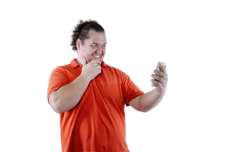 Selfie. Funny man and phone. White background. Isolatedの写真素材