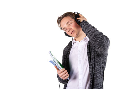 Young attractive student is listening to music.