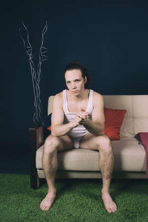 Young attractive man watching tv.の写真素材