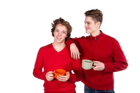 Two attractive guys are drinking coffeeの写真素材