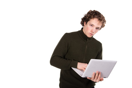 Two attractive students. Laptop. White background.