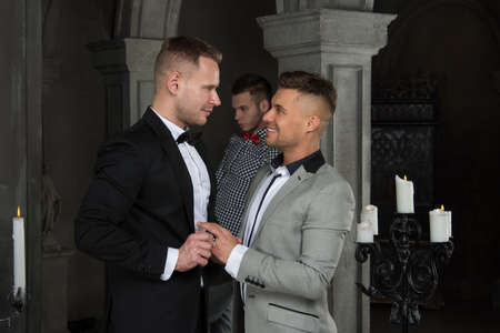 Gay wedding in the church. Beautiful couple and happy day.の写真素材