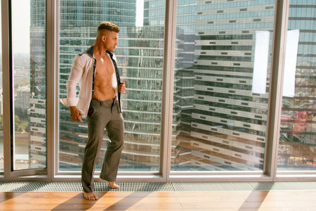 Handsome man. Sexy body. Home and job.の写真素材