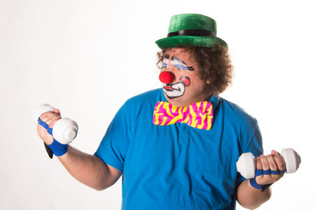 Holidays. Funny fat clown. White background.