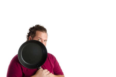 Kitchen, man, Tools. Funny case. Man posing on a white background.の写真素材