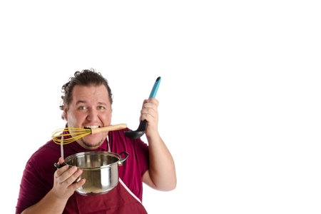 Kitchen, man, Tools. Funny case. Man posing on a white background.の写真素材