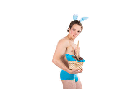 Easter. Funny attractive guy in a rabbit costume.の写真素材