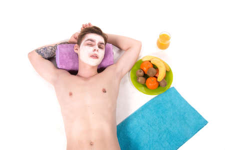 Male beauty. Attractive guy and spa. White background.の写真素材