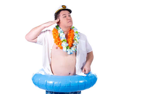 Funny fat guy and vacation. Happy man with an inflatable ring.の写真素材