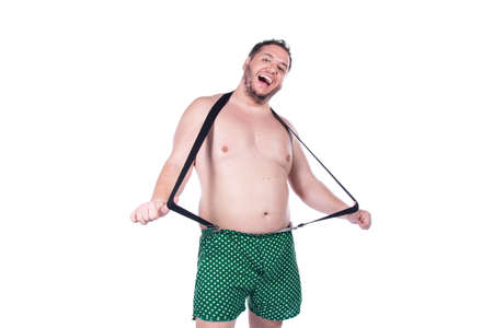 Funny fat guy with a rainbow flag. Happy man on a white background.の写真素材