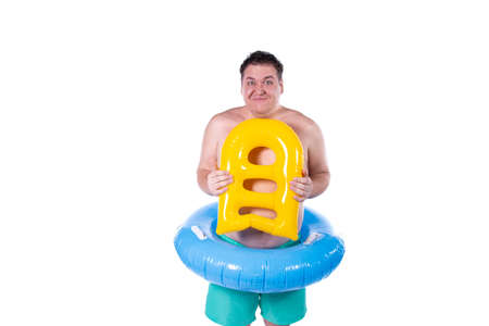 Funny fat guy and vacation. Happy man with an inflatable ring.の写真素材