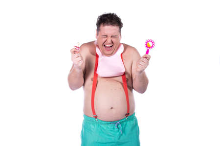 Funny fat guy with a rainbow flag. Happy man on a white background.の写真素材