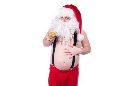 Fitness and healthy lifestyle. Funny Santa Claus.の写真素材
