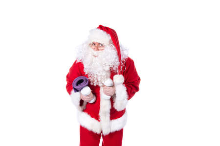 Fitness and healthy lifestyle. Funny Santa Claus.の写真素材
