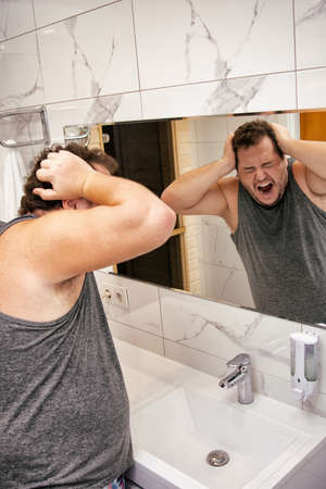 Good morning and funny fat man in the bathroom.の写真素材