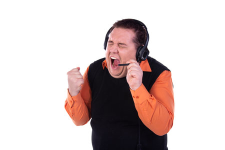 Support service and funny man talking on the phone.の写真素材