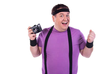 Retro style and fitness club. A funny fat man from the 80s goes in for sports.の写真素材