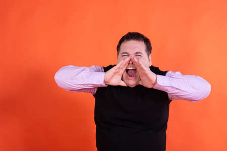Adult attractive man on a colored background. Business and work.の写真素材