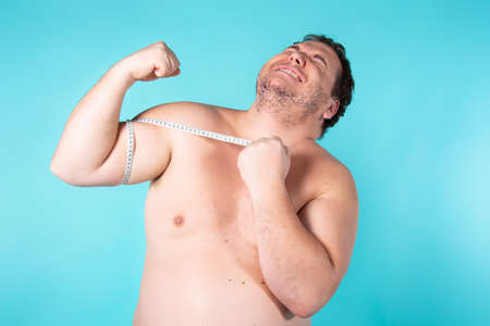 Funny fat guy on a diet.の写真素材