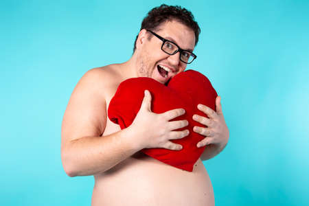 Funny fat man wakes up in the morning.の写真素材