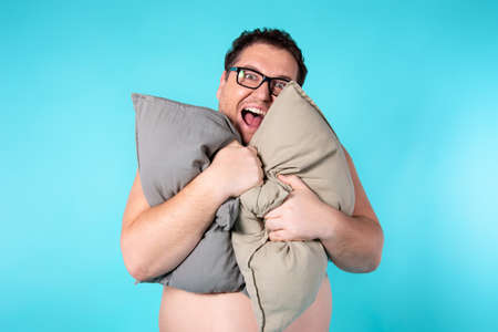 Funny fat man wakes up in the morning.の写真素材