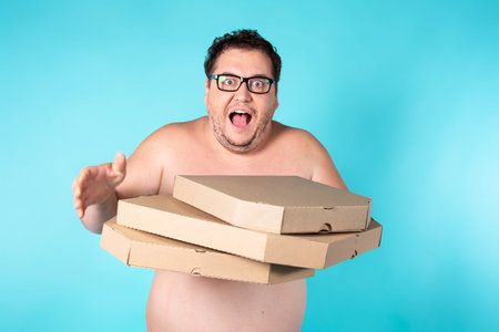 Funny fat man and pizza boxes.