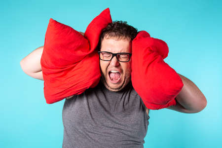 Funny fat man wakes up in the morning.の写真素材